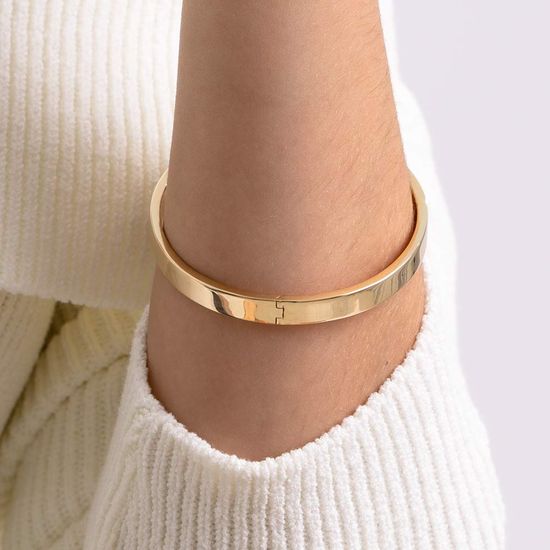 bracelete dourado com relógio