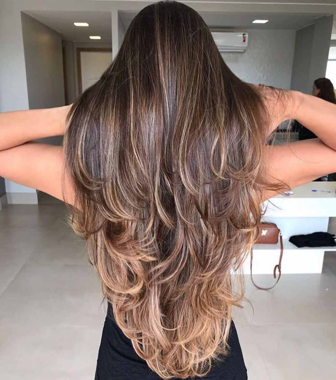 quanto custa um corte de cabelo longo repicado