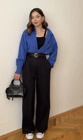 look com calça preta e tênis