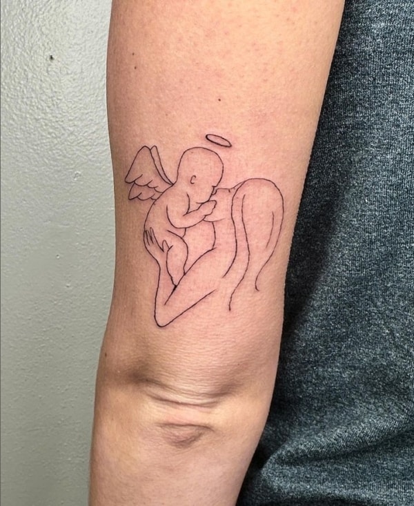 tatuagem anjo tribal braço