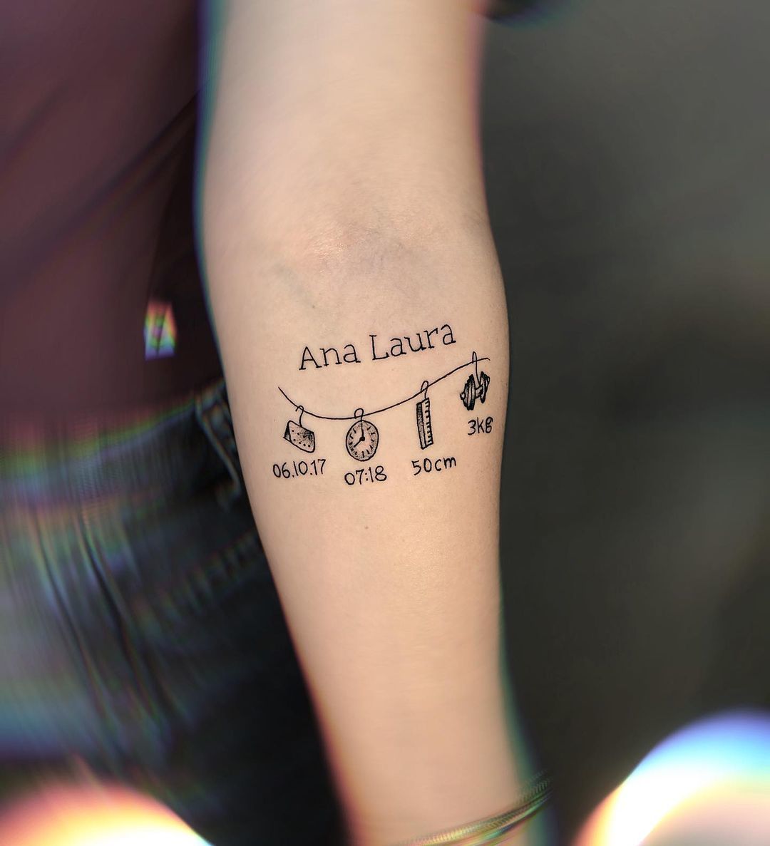 tatuagem com nome de filho no antebraço